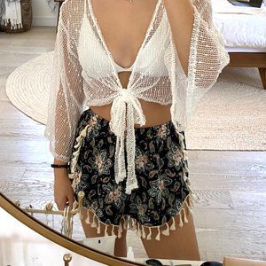 Black shorts with white tassels